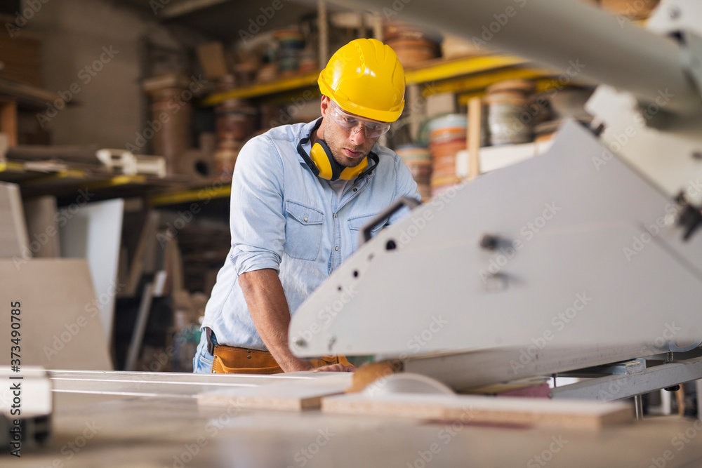 Carpenter using wood processing machine