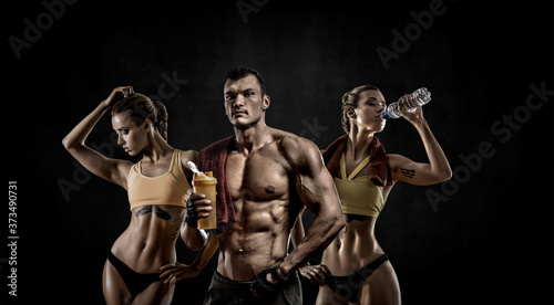 group of threesome man with woman bodybuilders