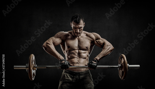 man bodybuilder, execute exercise with weight