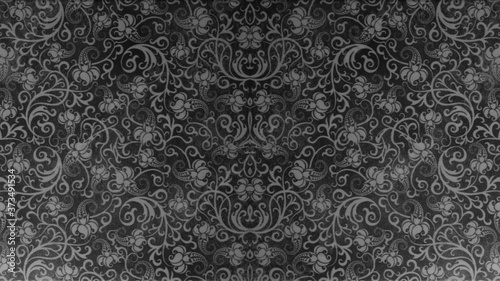 Old black anthracite gray vintage worn shabby seamless square patchwork tiles stone concrete cement wall texture background wallpaper, with flower leaves print 