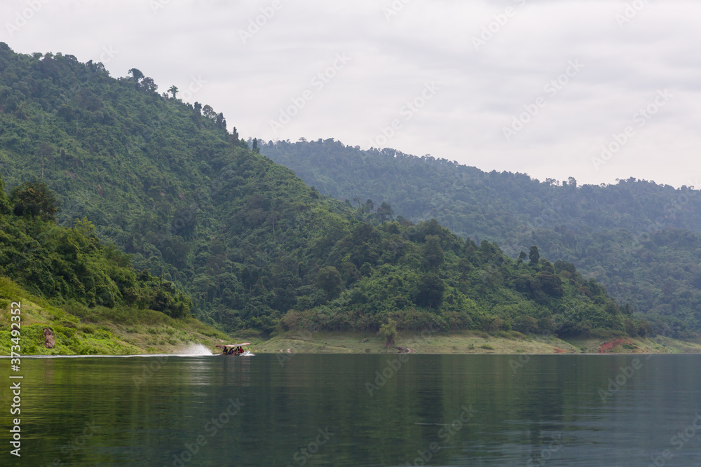Long tail boat is popular tourists enjoy the beauty of the nature in Khun Dan Prakan Chon Dam Nakhon Nayok Thailand Long tail boat is popular tourists enjoy the beauty of the nature in Khun Dan Prakan Chon Dam Nakhon Nayok Thailand