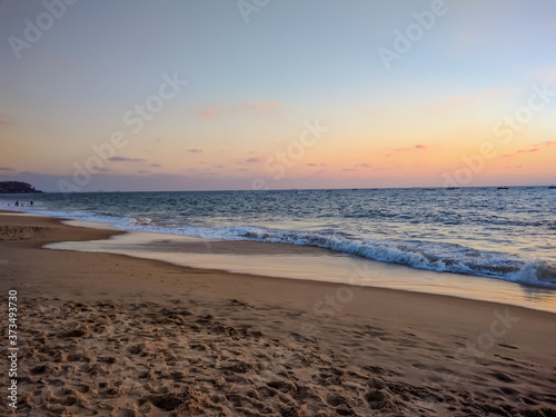 Fototapeta Naklejka Na Ścianę i Meble -  captured beautiful beach during sunrise at Candolim beach Goa with mobile camera