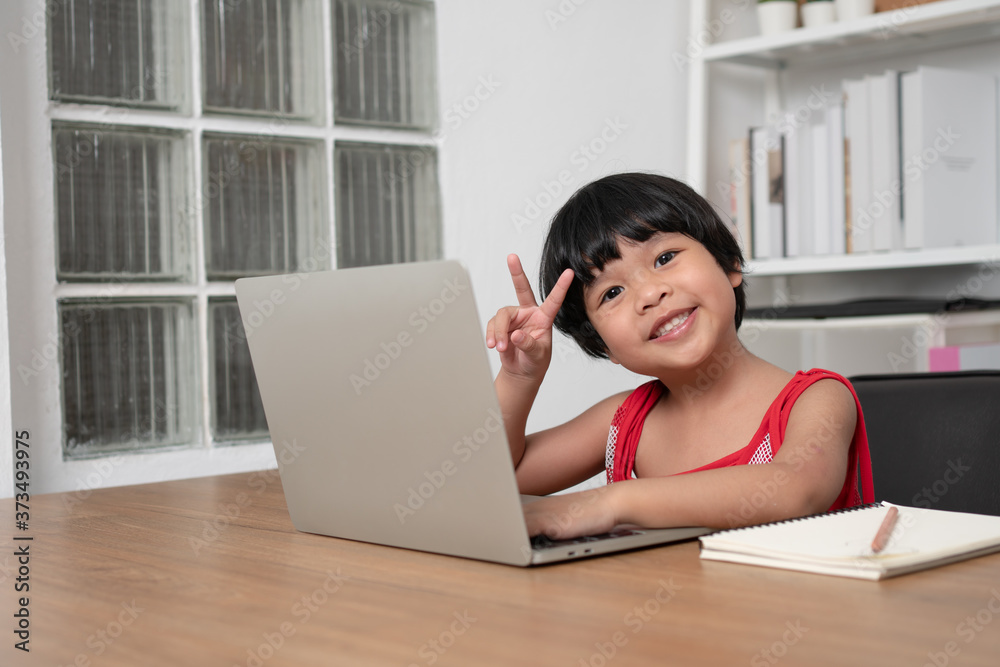 Happy Asian girl student online learning class from a computer with a teacher, online education is a technology for social distance in a new normal lifestyle, Concept of home school and tutor Happy Asian girl student online learning class from a computer with a teacher, online education is a technology for social distance in a new normal lifestyle, Concept of home school and tutor