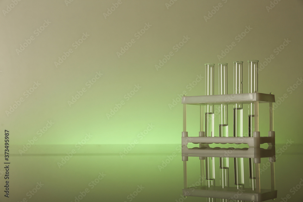 background with chemical flasks and tubes with reflection and copy space background with chemical flasks and tubes with reflection and copy space