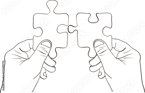 Hands holding two puzzle pieces together to find a solution