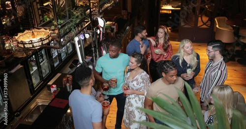 Drinking in a Busy Bar