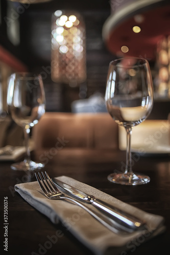 fork and knife serving in the interior of the restaurant / table in a cafe, food industry catering, menu