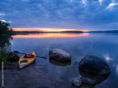yellow kayak on the lake at sunrise