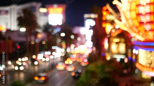 Defocused fabulous Las Vegas Strip boulevard, luxury casino and hotel, gambling area in Nevada, USA. Nightlife and traffic near Fremont street in tourist money playing resort. Neon lights of sin city.