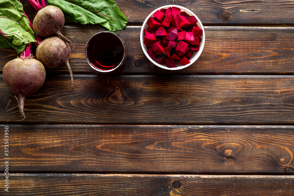 Top view of beet harvest. Green tops, slices, juice top-down space for text Top view of beet harvest. Green tops, slices, juice top-down space for text