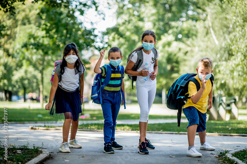 Children going back to school after epidemic, They are wearing a protective face mask