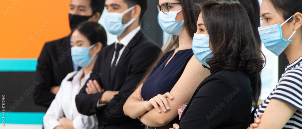 group of diversity business people wearing protective medical masks for protection from virus in office