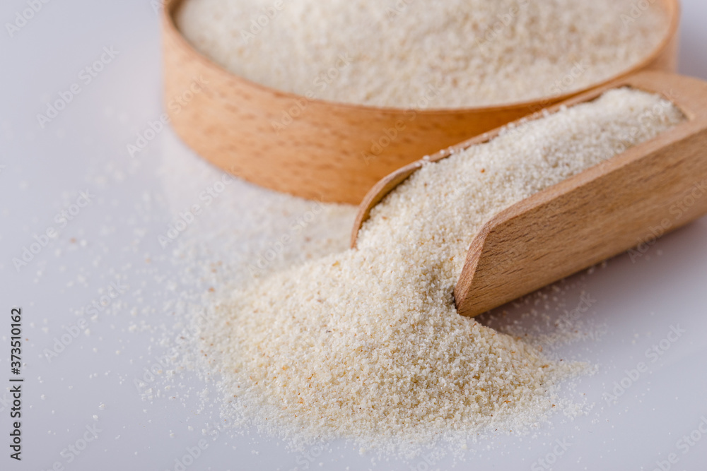 natural organic semolina on white acrylic background natural organic semolina on white acrylic background