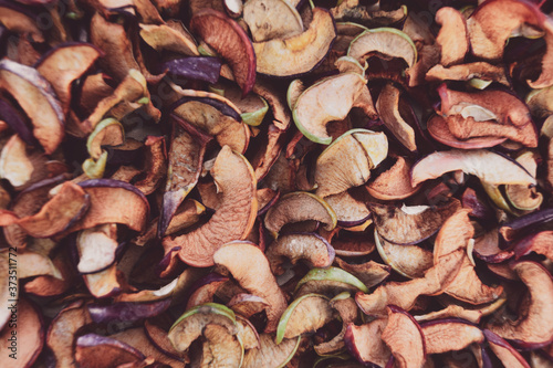 Natural dry Apple slices. Autumn background of cut dried fruit.