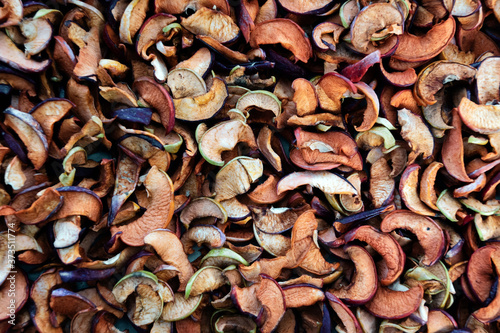 Slices of natural Apple. Autumn background of dried fruit.