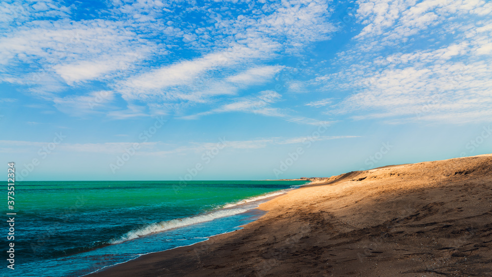 Obraz premium Summer sea beach in the shadow of clouds