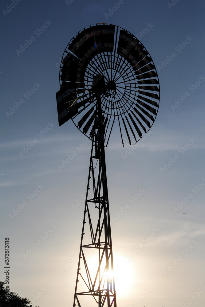 old wind mill silhouette sunset