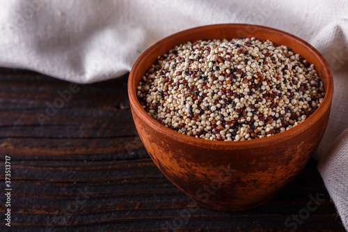 mix of quinoa grains on dark wooden rustic background