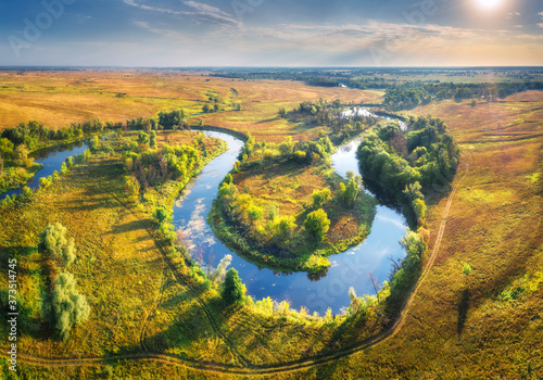 Fotografie Aerial view of beautiful curving river at sunrise in summer