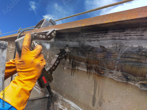 Checking defect in welded with process Magnetic Particle Testing(MT) of Non-Destructive Testing(NDT) at industrial factory.