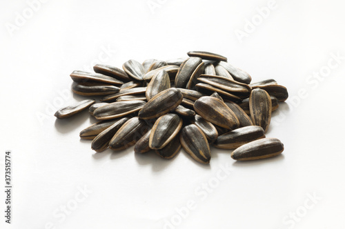 Pile of Sunflower seeds on white background.