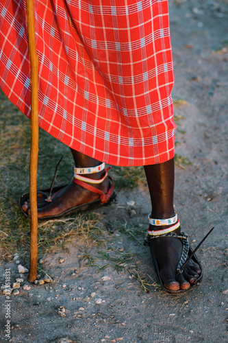 Close up of Maasai warrior with a traditional sandals photo