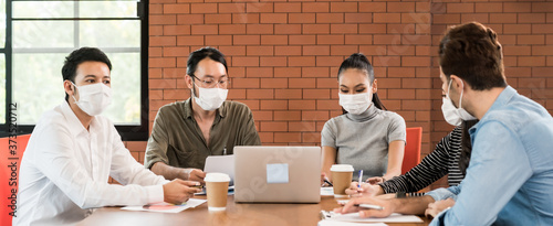Business person brainstorm in meeting room with face mask Panorama