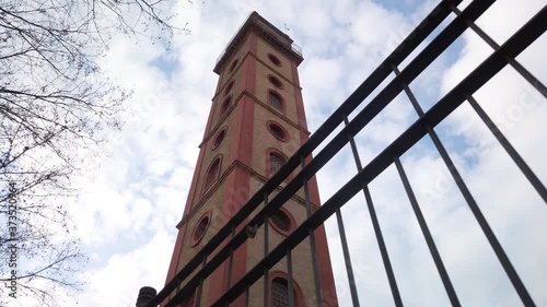 Perdigones Tower in Seville, Spain, Low Angle Slider on Cloudy Day photo