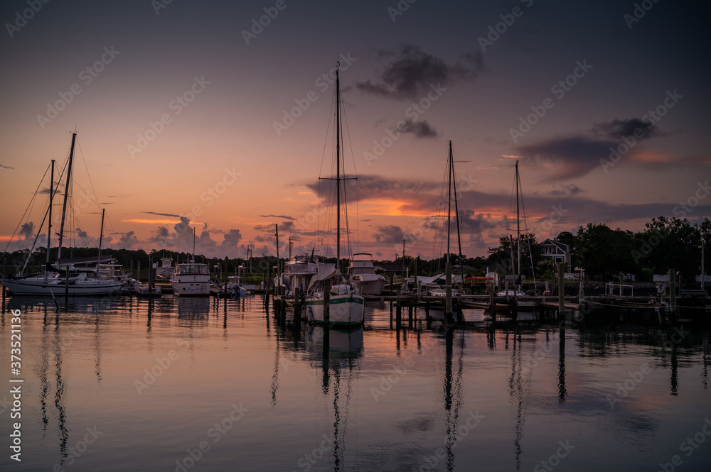 Sailboats at a marina at dawn in Beaufort North Carolina.