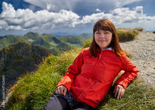 Young lady hiking in the mountains