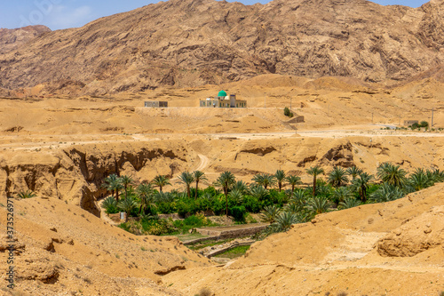 In Central Iran near the city of Tabas, A green oasis in the middle of the desert mountains  photo