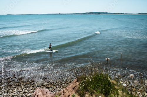 Photography surfing waves at iles de la Madeleine