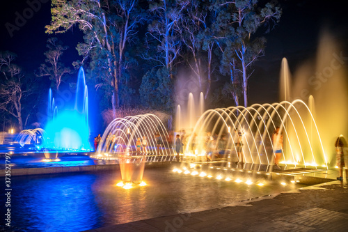 Colored musical water fountain at night. Shekvetili