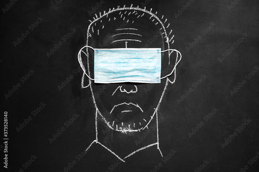 Chalkboard drawing: a man wearing a medical eye mask