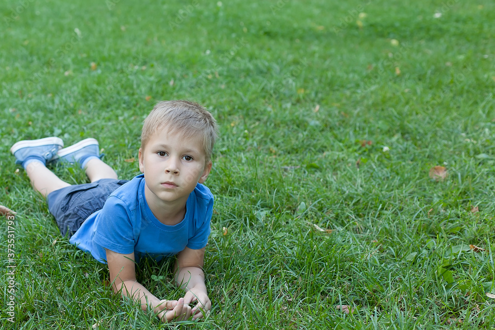Portrait of a happy little boy in the park. Portrait of a happy little boy in the park.