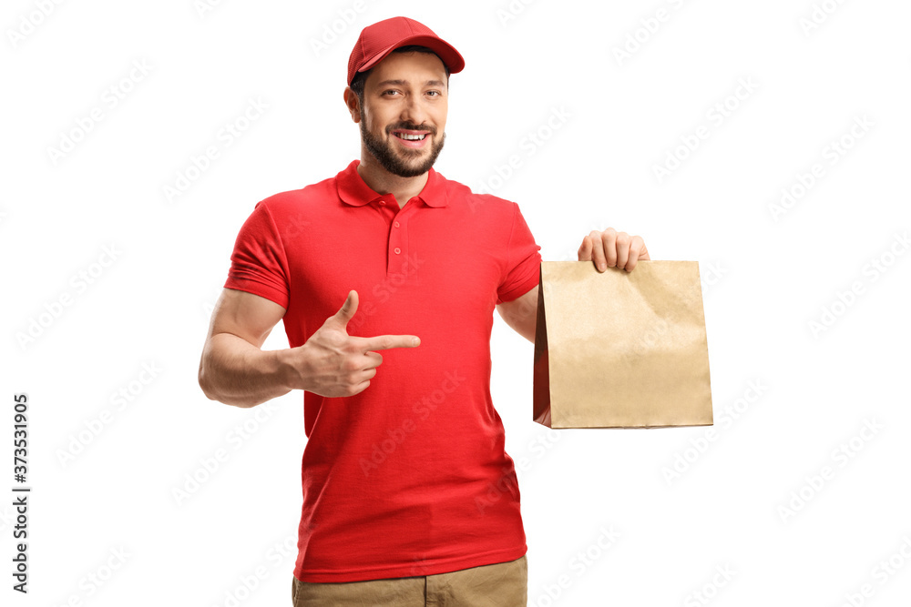 Food delivery man holding a paper bag and pointing Food delivery man holding a paper bag and pointing