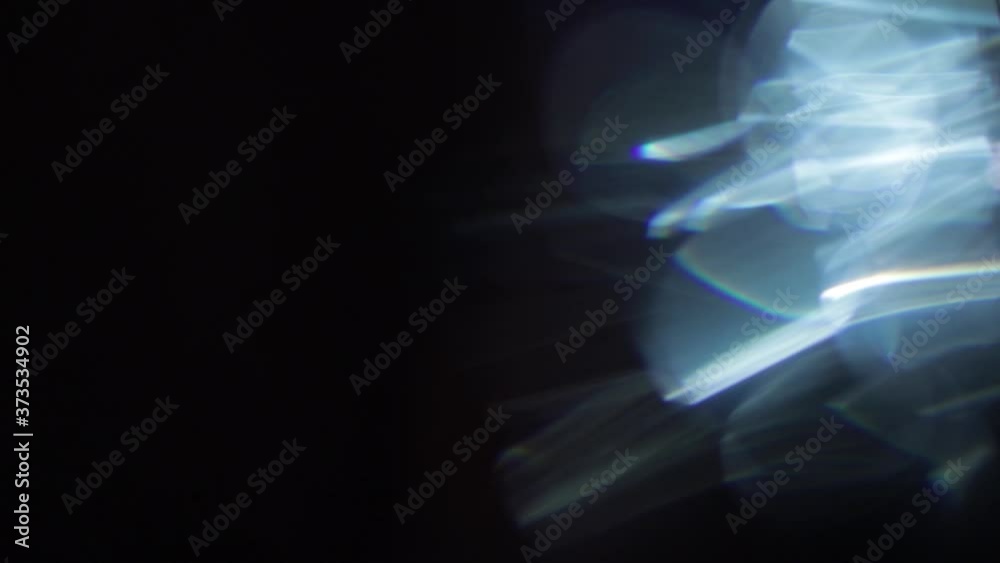Easy to add lens flare effects for overlay designs or screen blending mode to make high-quality video. Abstract sun burst, digital flare, iridescent glare over black background. Easy to add lens flare effects for overlay designs or screen blending mode to make high-quality video. Abstract sun burst, digital flare, iridescent glare over black background.