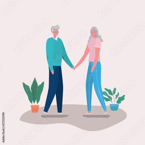 Senior woman and man cartoons with plants design, grandmother and grandfather theme Vector illustration
