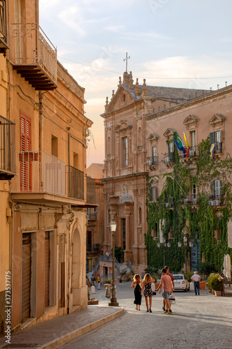 Agrigento, Sicilia, Italy - 18 August 2020 - Tourists walk on via Atenea towards piazza Pirandello photo