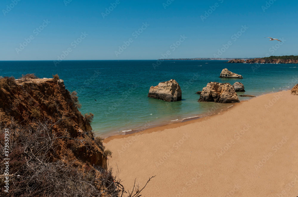 Da Rocha Beach. Great beach located in the town of Portimao. Fine sand beach, turquoise waters. Surrounded by cliffs, huge rocks and caves.