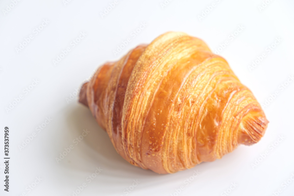 Close up fresh croissant on white background. Close up fresh croissant on white background.