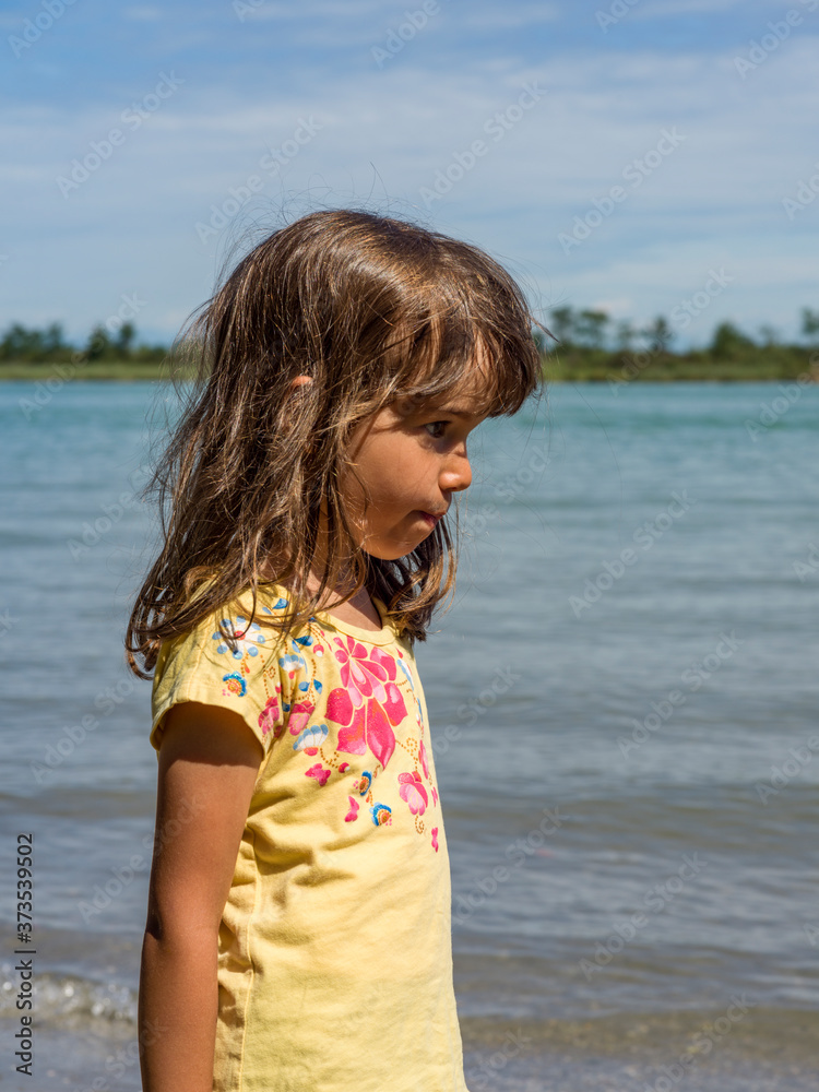 Portrait little girl with lagoon background Portrait little girl with lagoon background