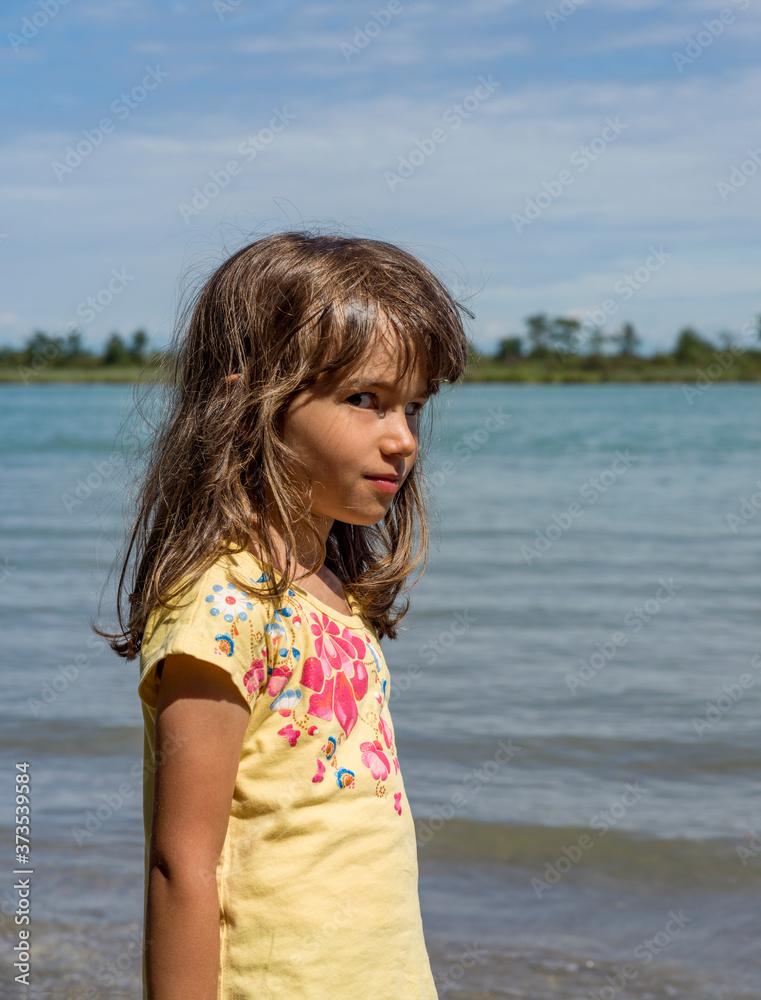 Portrait little girl with lagoon background Portrait little girl with lagoon background