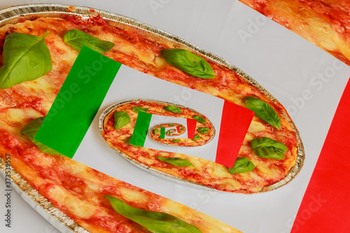 effect droste italian pizza, typical italian pizza  made of tomato,basil and mozzarella with the italian flag in the background /The effect Droste is an image that appears inside itself repeatedly