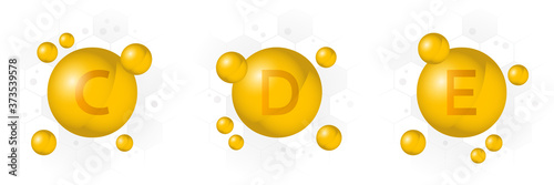 Vitamin C, D, E icon. Golden bubble on hexagon background. Vector illustration