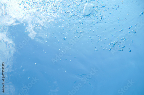Bubbles in water of the swimming pool
