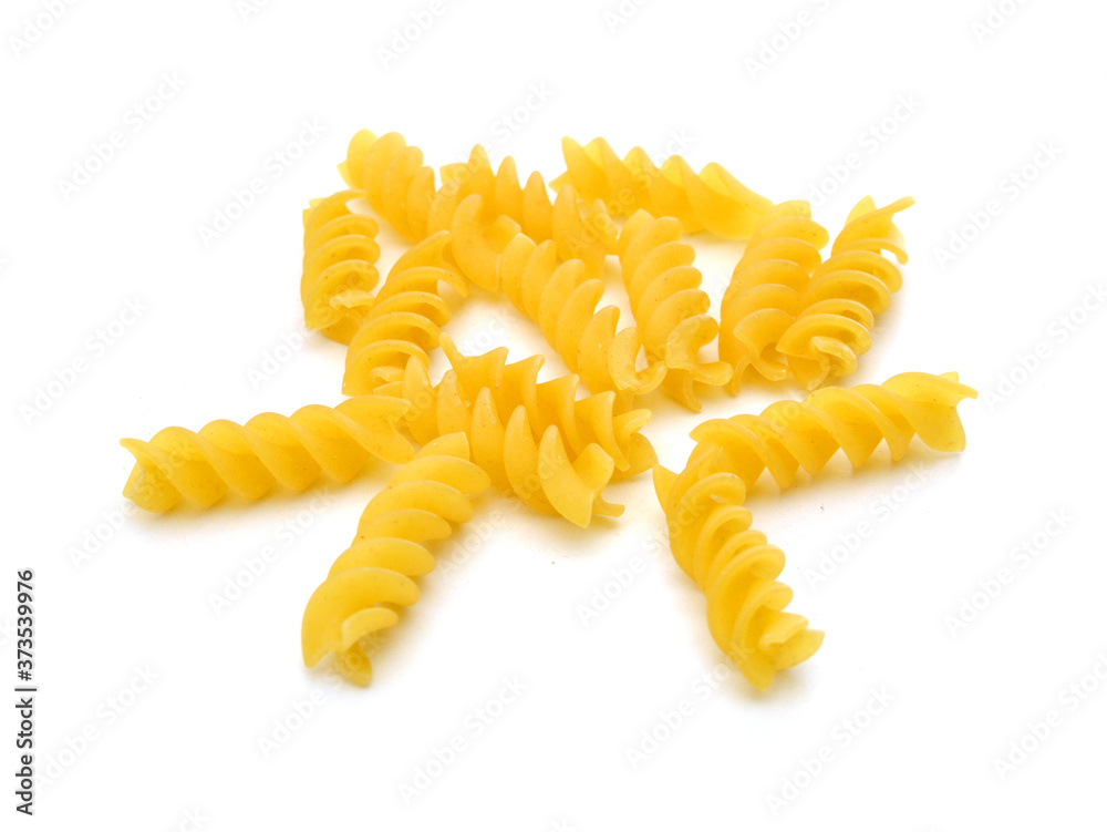 A portion of Rotini corkscrew pasta isolated on white. A portion of Rotini corkscrew pasta isolated on white.