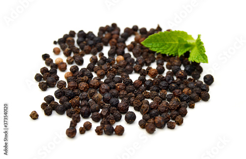 Black pepper on a white background and isolated