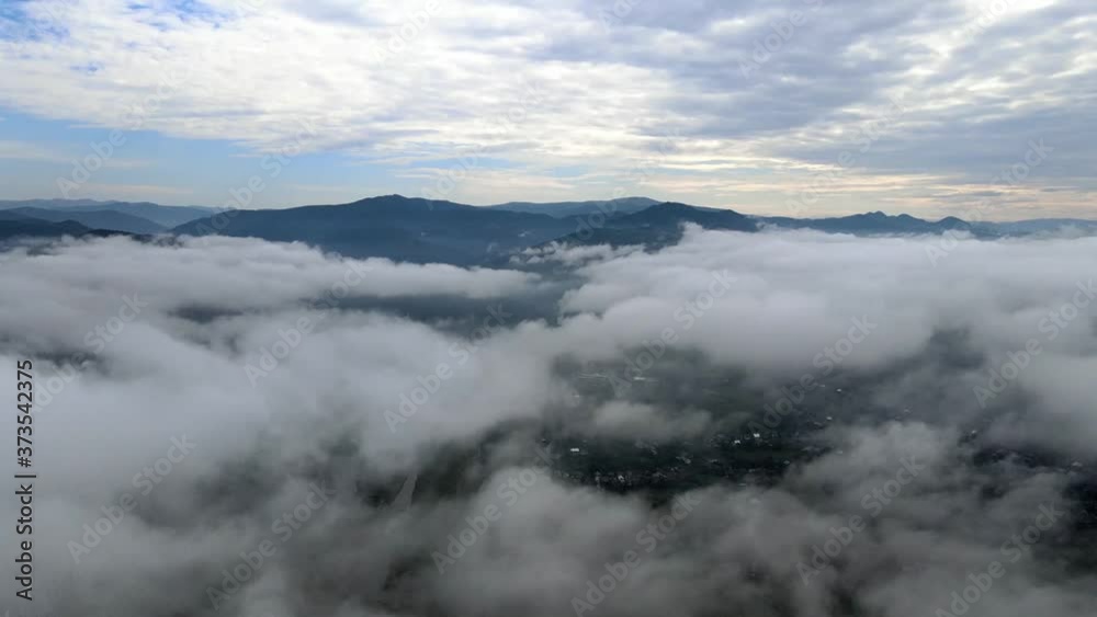The drone is slowly descending into the clouds The drone is slowly descending into the clouds