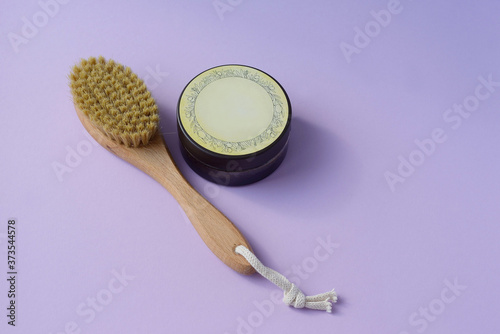 a jar of beldi and a crusher drainage brush for body massage photo